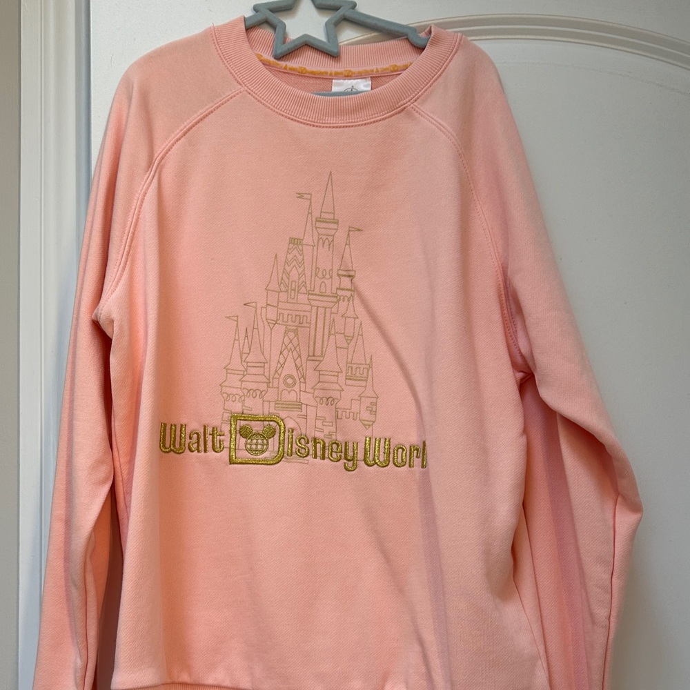 Disney Peach Sweatshirt with Castle Design stain on sleeve
